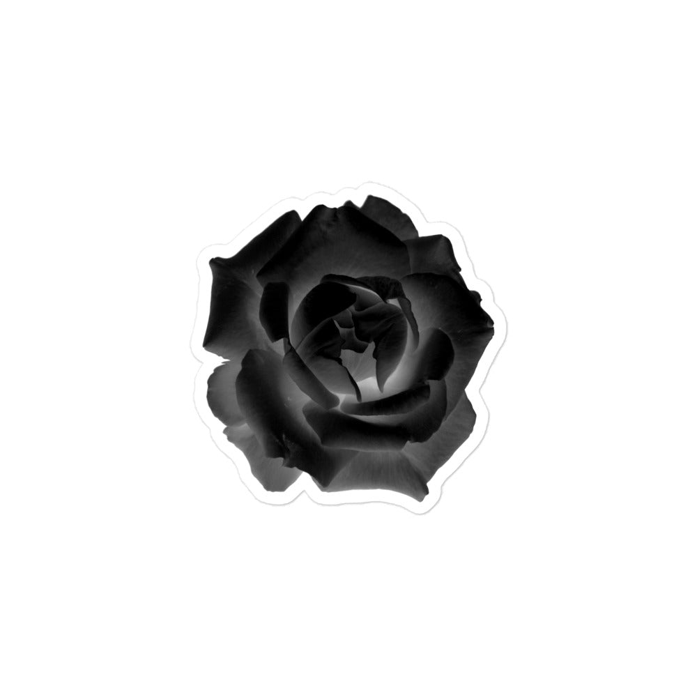 A small kiss-cut vinyl sticker with an image of a black x-ray rose design.