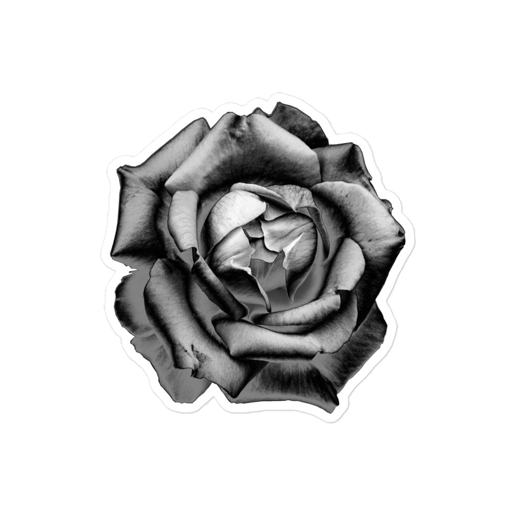 A medium kiss-cut vinyl sticker with an image of a grey charcoal drawing style rose.