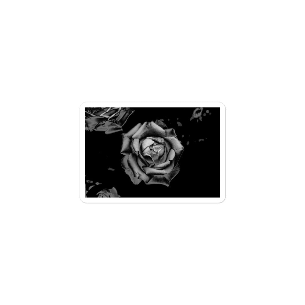 A small rectangular vinyl sticker with an image of a grey charcoal rose design.