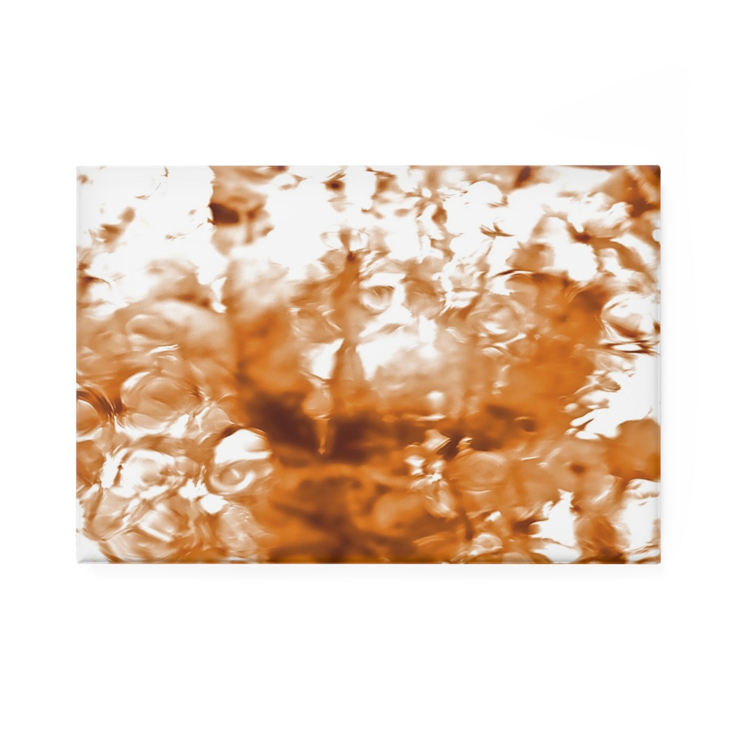 A rectangular button magnet with an image of a vivid orange water reflection design.