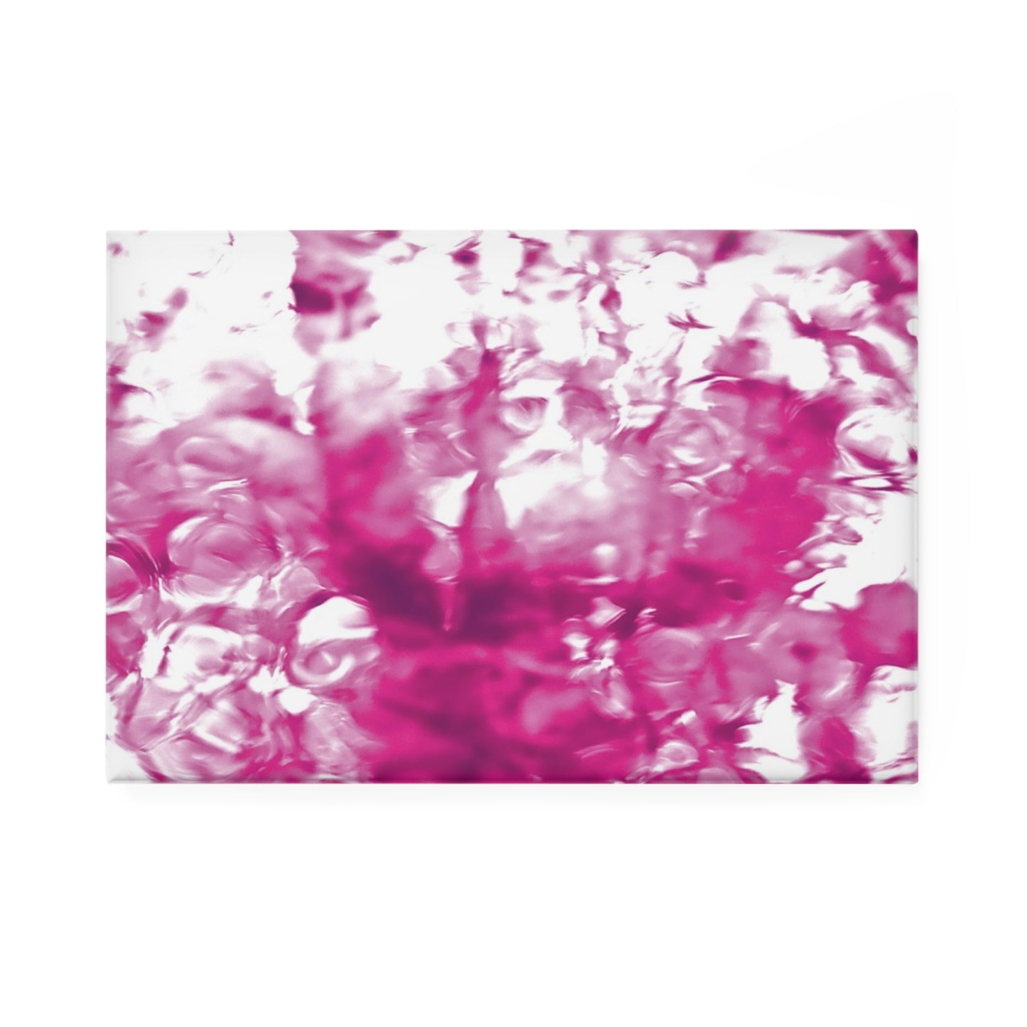A rectangular button magnet with an image of a vivid pink water reflection design.