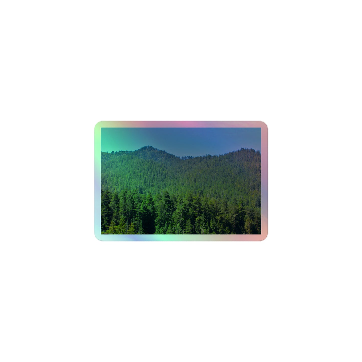 A small rectangular holographic sticker with a landscape image of blue sky, mountains, and green redwood trees.