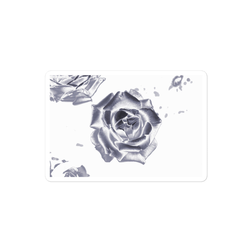 A medium rectangular vinyl sticker with an image of a reflective silver rose design.