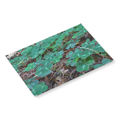 Field_of_Clover_Amid_Redwood_Needles_Re_RectangleButtonMagnet_H_Angle_Mockup.png