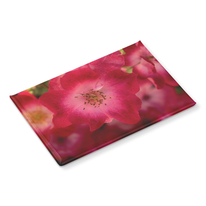 Softly_Lit_Pink_Roses_with_Light_Centers_RectangleButtonMagnet_H_Angle_Mockup.png