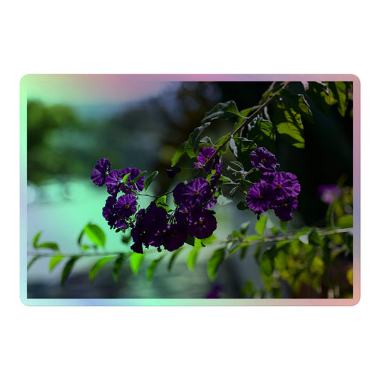 A large rectangular holographic sticker with an image of purple flowers on a tree branch.
