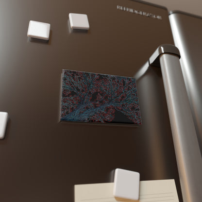 Lifestyle photo of a rectangular button magnet with an image of a neon blue and red tree design with lightning like features, placed on a fridge.