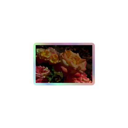 A small rectangular holographic sticker with an image of pink, orange and yellow roses in a garden.