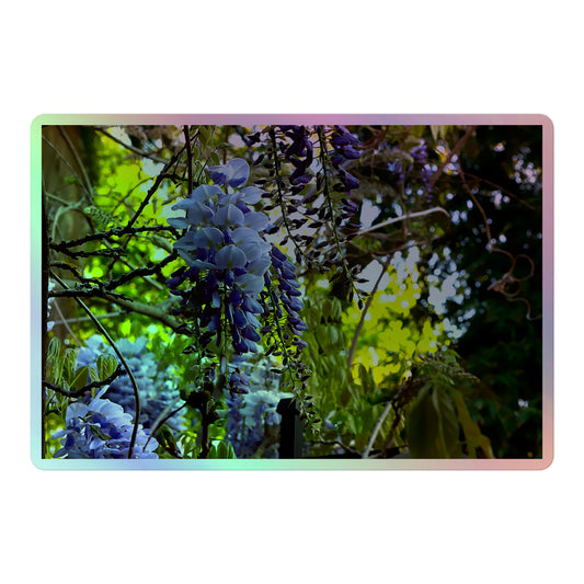 A large rectangular holographic sticker with an image of purple wisteria blooms in a vibrant green garden.