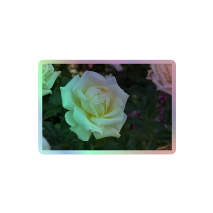 A medium rectangular holographic sticker with an image of a cluster of white roses with dark green leaves.