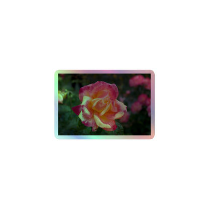 A small rectangular holographic sticker with a close-up image of a close-up image of pink and yellow rose bloom in a garden.