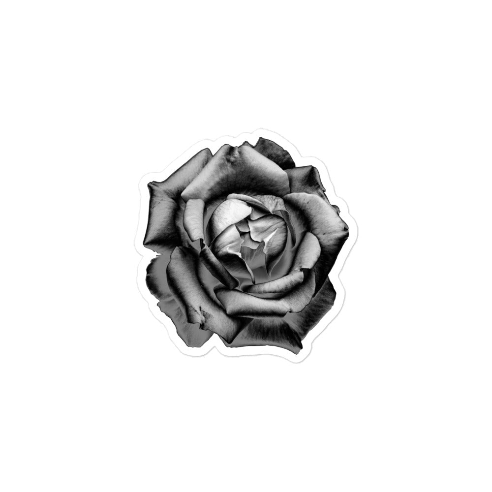 A small kiss-cut vinyl sticker with an image of a grey charcoal drawing style rose.