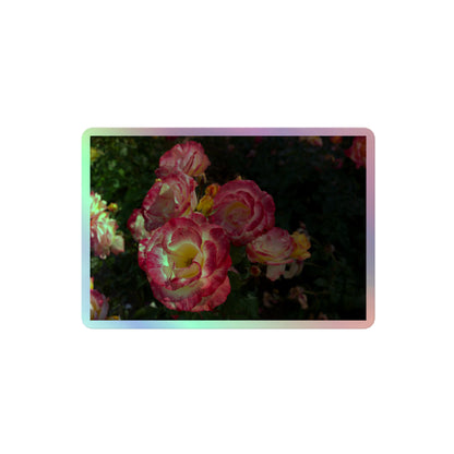 A medium rectangular holographic sticker with an image of pink, yellow and white rose blooms with dark green leaves.