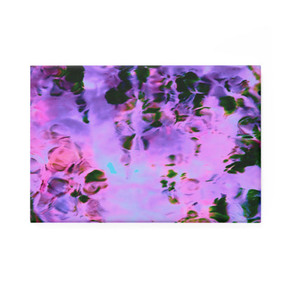 A rectangular button magnet with an image of a vivid pink and purple water reflection design.