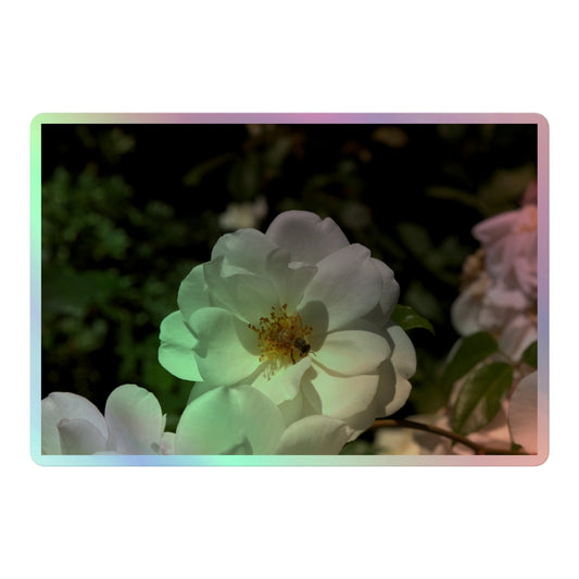A large rectangular holographic sticker with an image of a white rose bloom with a honeybee on it.
