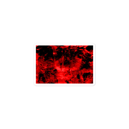 A small rectangular vinyl sticker with an image of a vivid red and black water reflection design.