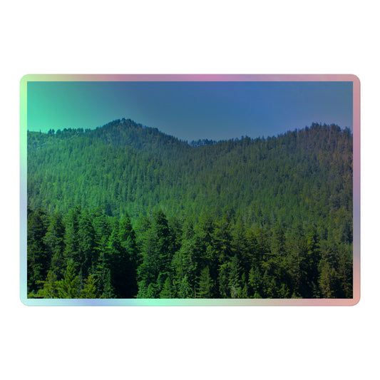 A large rectangular holographic sticker with a landscape image of blue sky, mountains, and green redwood trees.